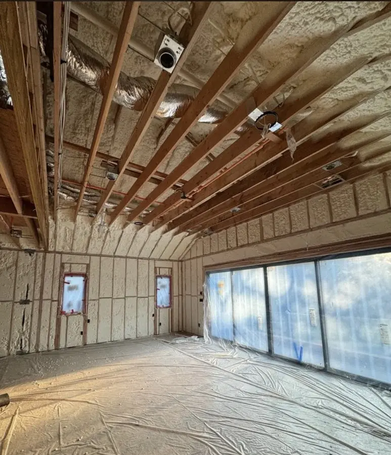 Interior walls and ceiling insulated with spray foam during new construction in National City